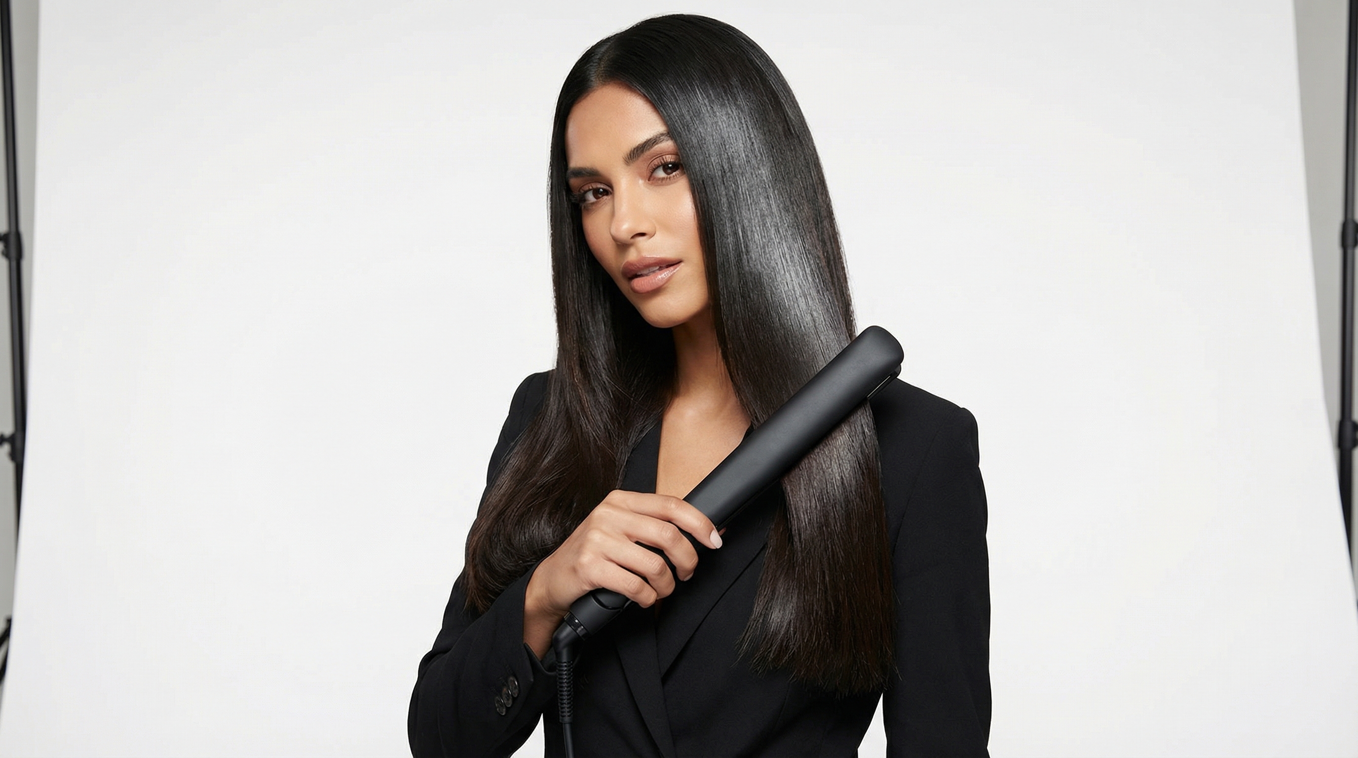 woman straightening thick hair without frizz step by step tutorial