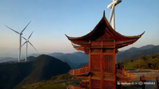 远景拉镜头 | 远处的风力发电机在山风中缓缓转动，旁边是古老的侗族鼓楼，山风拂过鼓楼的檐角，发出轻微的声响。 | 风力发电机、侗族鼓楼、山风声响、转动的风机叶片 | by Hailuo AI Video Generator