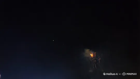 中景镜头，聚焦天空
内容: 第一束礼花从地面发射，迅速升空，在夜空中绽放成五彩斑斓的花朵.
细节: 礼花的颜色有红色、蓝色、绿色、黄色等，形状各异，有的像菊花，有的像星星，有的像瀑布.
效果: 礼花绽放时发出耀眼的光芒，照亮了周围的城市建筑，同时也映照出中国人们的笑脸 by Hailuo AI Video Generator