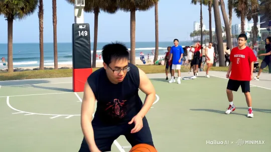 我是一个极其厉害的篮球接球手，在洛杉矶海边球场跟一群不同肤色的球员比赛，一个漂亮的变向过人后，使出了神似乔丹的大力扣篮，扣篮过程中镜头环绕主体且速度减慢到 1/3 by Hailuo AI Video Generator