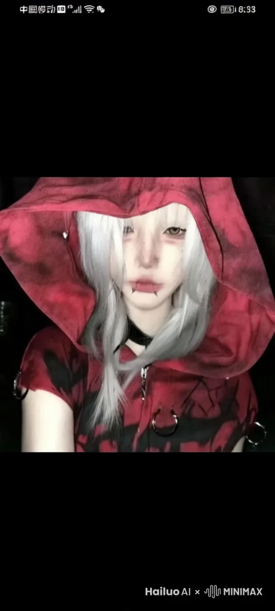 一只蓝尾美人鱼坐在海浪轻轻拍打的石礁上 by Hailuo AI Video Generator