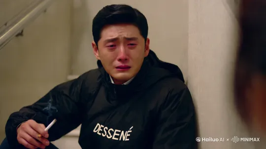 视频生成信息.,一个 28 岁中国北方男人,立体五官,帅气,高傲,自信,大师品质高清,手里夹着半根点燃的香烟,失去心爱的女孩后哭泣的像个孩子,撕心裂肺,满脸的痛苦与委屈,在一个楼梯间,后背依靠着墙上,黑色迪桑特防风衣,无助感,无力感,失去了女孩就失去了全世界,哭的撕心裂肺,时长 30 秒,过程中表现出痛苦与悲伤且又无人述说 by Hailuo AI Video Generator