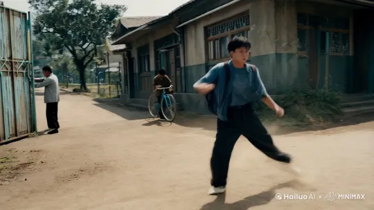 一个爱打架的高中生在学校门口打架，一个修自行车的男人，背景是九十年代的小镇中国小镇 by Hailuo AI Video Generator