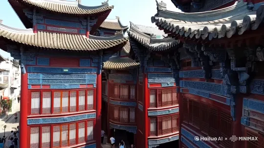 拈花湾  中景镜头 

拍摄方式:无人机府伯

运镜: 沿街道缓缓推进
速度: 中等速度，略带缓慢
画面:
镜头沿着拈花湾的街道缓缓推进，从街道的一端移动到另一端。
捕捉唐风宋韵建筑的细节，如飞檐斗拱、雕花窗棂等，展现建筑的精美与独特。
镜头稍微拉近，捕捉到灯光与建筑细节的互动，如灯光透过窗棂洒下的光影变化。
偶尔捕捉到行人或游客，展现拈花湾的热闹与活力。
沿着街道缓缓前行，仿佛置身于一个梦幻的唐宋世界。灯火辉煌，建筑精美，每一处细节都散发着浓厚的文化气息。 by Hailuo AI Video Generator