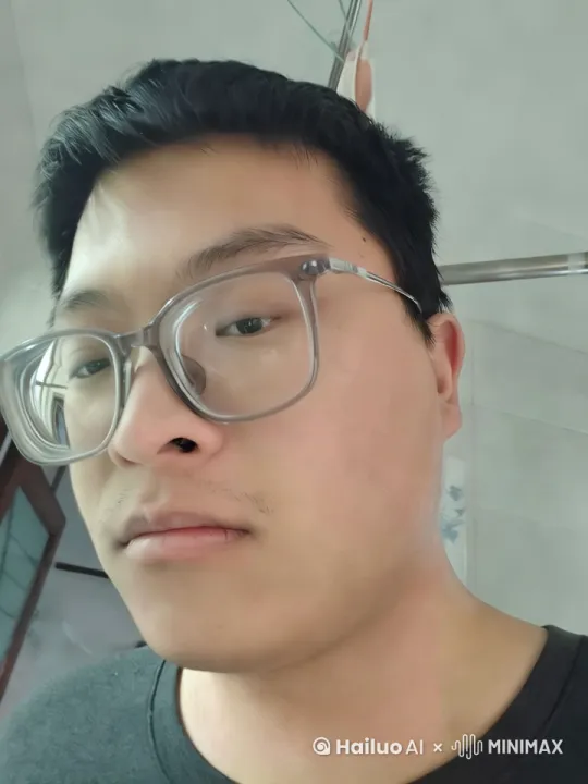 中景镜头，一个坐在电脑前的亚洲中年男性，一遍抽着烟一边刮彩票，发现刮出了100万，立刻兑换了现金，镜头轻轻后拉。从此衣食无忧，过上了幸福生活 by Hailuo AI Video Generator