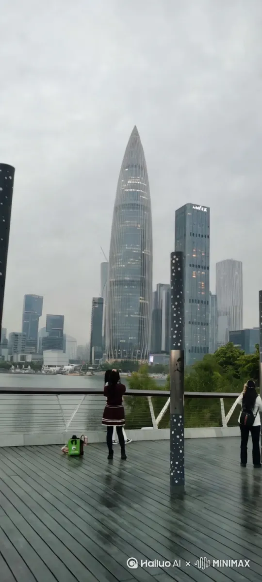 图中一座尖顶的圆锥体摩天大楼，以火箭发射般的姿态缓缓升空，升空时建筑底部喷射火箭气焰，将观众带入一场超现实的视觉盛宴。中远景，平视视角，动态镜头跟随圆锥体摩天大楼的上升轨迹移动。 by Hailuo AI Video Generator