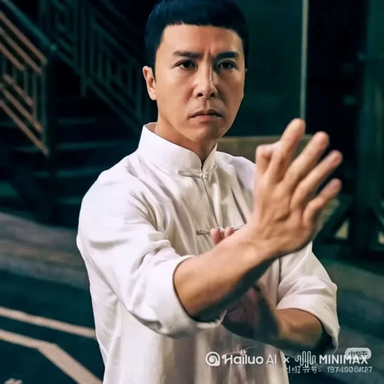突然伸出手枪，用甄子丹的声音大声说：Looking in my eyes , tell me ,why ？baby why?回答我! by Hailuo AI Video Generator