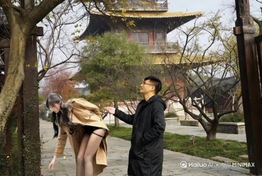 镜头中两个人，左边女的长得在地上捡落叶，然后转过头来和男的对视，他们双手拉在一起，镜头拉进给两个人特写注意画面一致性，两个人不要有明暗差 by Hailuo AI Video Generator