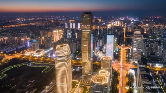 郑州CBD从黑夜到日出的航拍俯瞰视频，镜头从左到右围绕中心楼层稳步移动 by Hailuo AI Video Generator