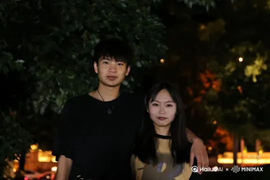 女孩转身与男孩拥抱。男孩抱向女孩时女孩所有补位变成一大团微小深红色花瓣,花瓣向右扩散主体人物身体随之从四肢开始逐渐瓦解,化作无数红色粒子轻盈飘散,最终女孩人物完全消失在漫天飞舞的花瓣中,女孩人物完全消失,男孩伸手挽留花瓣,写实风格电影光效, by Hailuo AI Video Generator